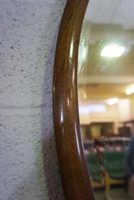 An Edwardian oval mirror on stand, with carved supports, 73cm high, 82cm wide; and another oval - Image 9 of 10