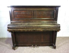 A small Art Deco upright piano, by Harrington, London, in a walnut veneered case, serial number