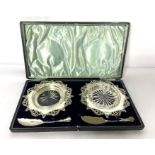 A pair of Edwardian silver butter dishes, hallmarked Sheffield 1908, Walker & Hall, each with a