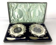 A pair of Edwardian silver butter dishes, hallmarked Sheffield 1908, Walker & Hall, each with a