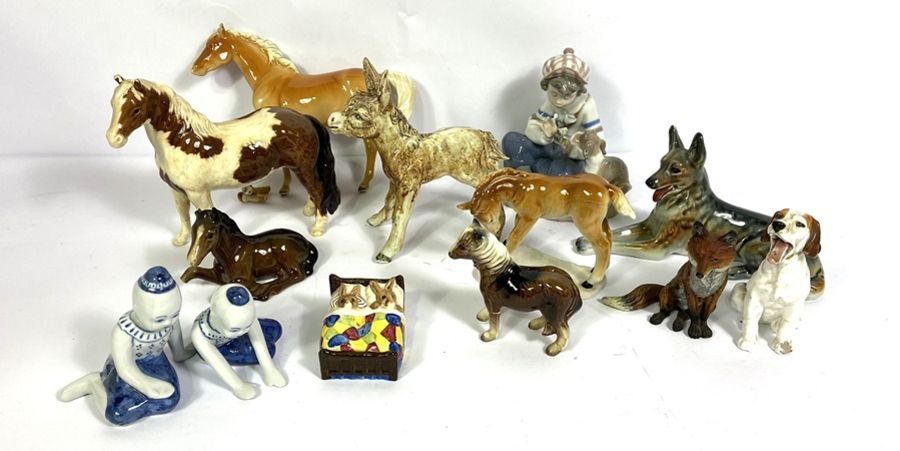 A group of assorted ceramic animals, and figurines, including Horses, a Donkey, a German Shepherd