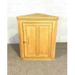 A stripped pine corner cabinet; together with a vintage Deco style longcase clock; a Victorian piano