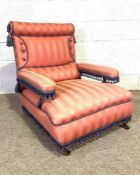 A late Victorian armchair, circa 1900, with a low deep seat, currently upholstered in claret with