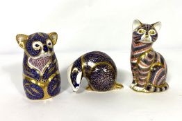 Three Royal Crown Derby bone china paperweight figures, including a Koala (1940), Badger (1938)