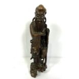 A Japanese root carving of an Immortal, standing holding a staff, Meiji period, 19th century