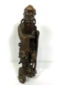 A Japanese root carving of an Immortal, standing holding a staff, Meiji period, 19th century