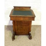 A late Victorian walnut Davenport desk, circa 1900, with leathered writing slope and four side