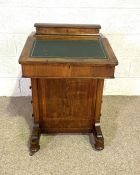 A late Victorian walnut Davenport desk, circa 1900, with leathered writing slope and four side