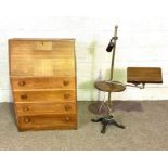 A modern oak veneered bureau, 72cm wide; together with a cast iron based adjustable reading stand,