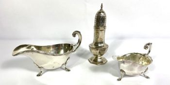 A George VI silver sauce boat, hallmarked Sheffield 1936, Viners; together with a Silver castor,