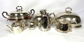 An associated group of silver plate, including two meat covers, an tureen, vegetable dish, and