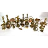A large group of small brass miniature ornaments, including candlesticks and related items (a lot)