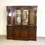 A George III reproduction mahogany veneered breakfront bookcase, 20th century, with dentil cornice