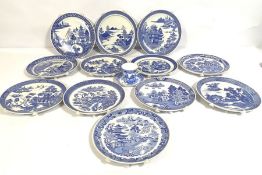 A large collection of modern blue an white Willow pattern tableware, also a group of decorative