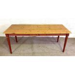A modern long pine Kitchen refectory table, with painted legs, and a single drawer, 77cm high, 193cm