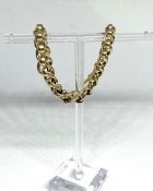 A 9 carat gold curb chain bracelet, (link behind clasp marked 375), 21cm long, 19.5g