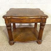 An early 20th century mahogany two tier occasional table, with fluted frieze and tapered legs,