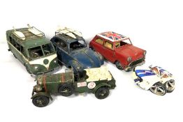 A small group of model cars, including a vintage racing green Bentley Blower; A surfer’s VW camper