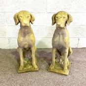 A pair of composition stone garden gate figures of hunting dogs, circa 2000, standing at