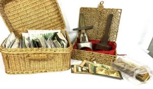 A quantity of ephemera, including a basket of postcards; A stereoscopic slide viewer and a small