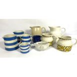 Assortment of decorative ceramics, including four graduated Cornish ware jugs by T Green; a puffin