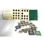 A box containing a large assortment of coinage, mainly UK denominations, including Royal