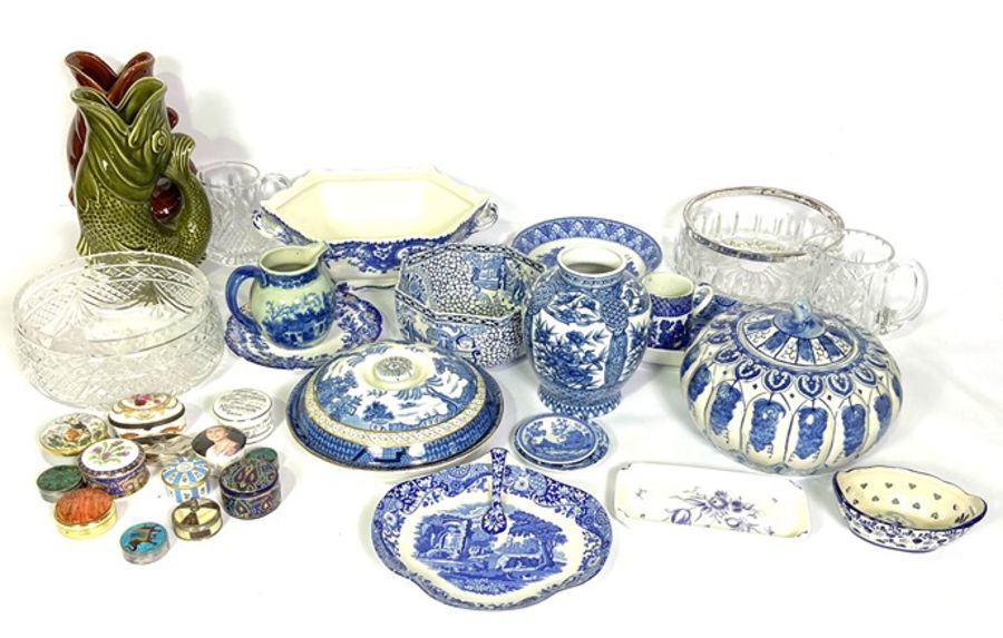 A varied assortment of ceramics and glass, including modern blue and white china, two fish jugs