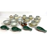 A variety of decorative kitchen Stoneware, including light blue soup bowls, matching serving pots;