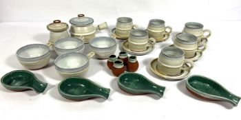 A variety of decorative kitchen Stoneware, including light blue soup bowls, matching serving pots;