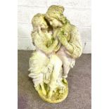 A modern composition stone garden sculpture of two lovers, standing hand in hand, circa 2000, with