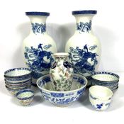 A pair of Qianlong style Chinese blue and white porcelain baluster vases, late 20th century, both
