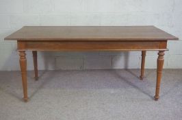 A small dining or kitchen table, 20th century, with a plain rectangular top on four turned and
