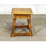 A 17th century oak joint stool; together with and elm seated stool; and two small country stools (