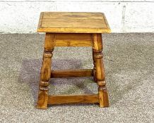 A 17th century oak joint stool; together with and elm seated stool; and two small country stools (