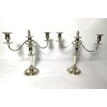 A pair of George III style silver plated candelabra, each with three sockets and two scrolled