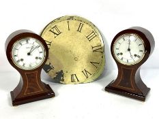 An assortment of clock parts and faces, including gilt brass hood capitals; also two balloon