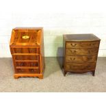 A George III style compact bow front chest of four drawers, 84cm high, 67cm wide; together with a