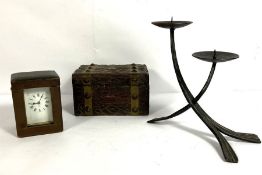 A cased gilt brass carriage clock, with travel case; together with a small box and a modern candle