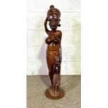 A large African carved figure of a tribal woman and her child, 20th century, 95cm high; together