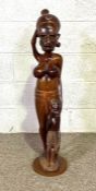 A large African carved figure of a tribal woman and her child, 20th century, 95cm high; together