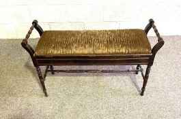 An Edwardian duet piano stool, with scroll arm supports and hinged seat; together with a cast iron