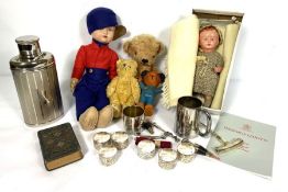 A group of miscellaneous items, including a large vintage teddy bear, assorted dolls, a cased set of