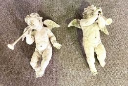 A pair of Rococo style ‘plaster’ winged putti, 51cm high (2)