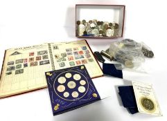 An assortment of collectible coins, including commemorative £5 coins, assorted pennies, crowns