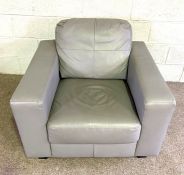 A modern grey leathered armchair, with deep comfortable seat