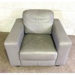 A modern grey leathered armchair, with deep comfortable seat