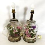 A pair of decorative glass table lamps, each made from a nearly identical Chinese baluster shaped