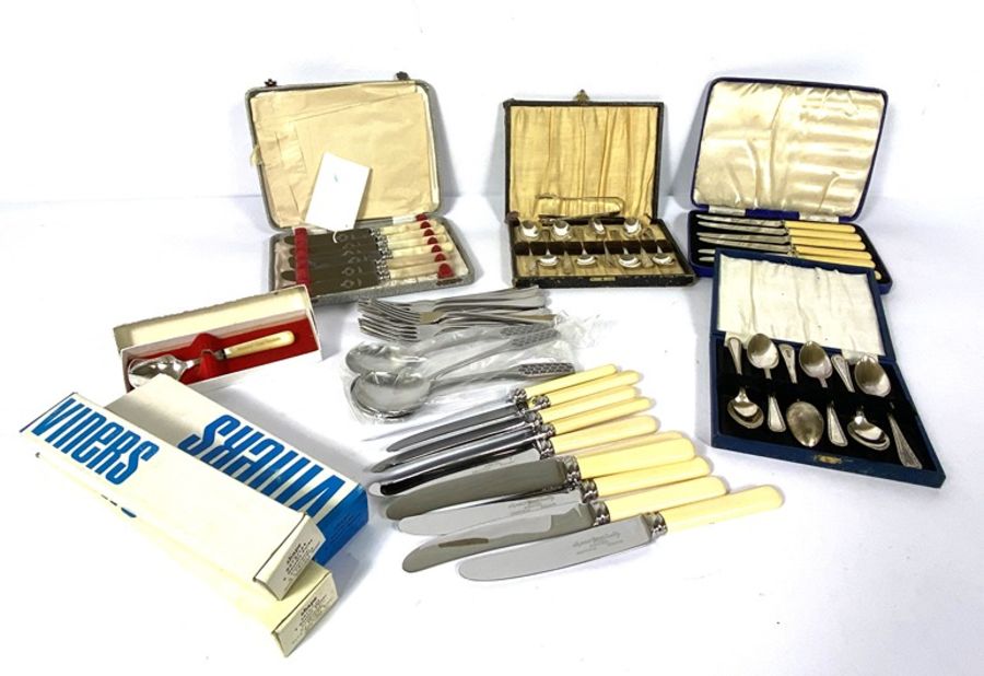 Assortment of flatware, including various cased sets of bone handled knives, a carving set, silver