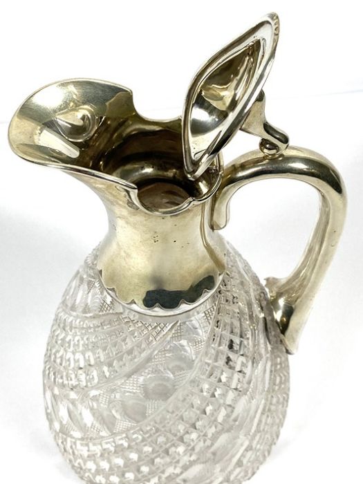 A silver mounted claret jug, hallmarked Birmingham 1919, with a pouring spout, hinged lid and scroll - Image 7 of 7