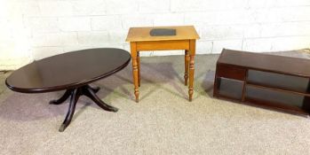 A small oval 'mahogany' varnished coffee table, modern; together with a small occasional table and a